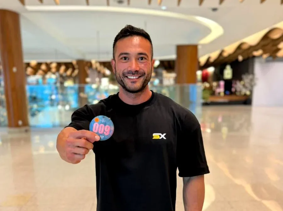 Syntex Team member smiling at a check-in