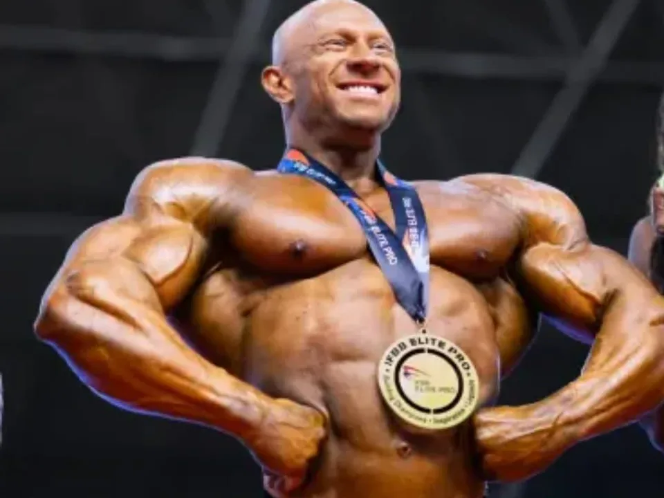 Syntex Team athlete with his IFBB Elite Pro medal