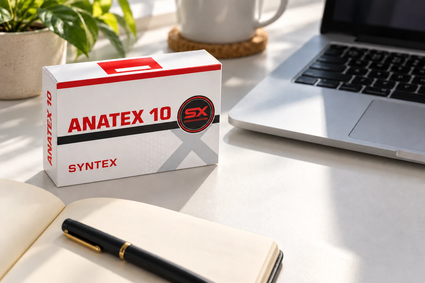 Illustrative Syntex Anatex packaging beside a notebook and laptop for product enquiries