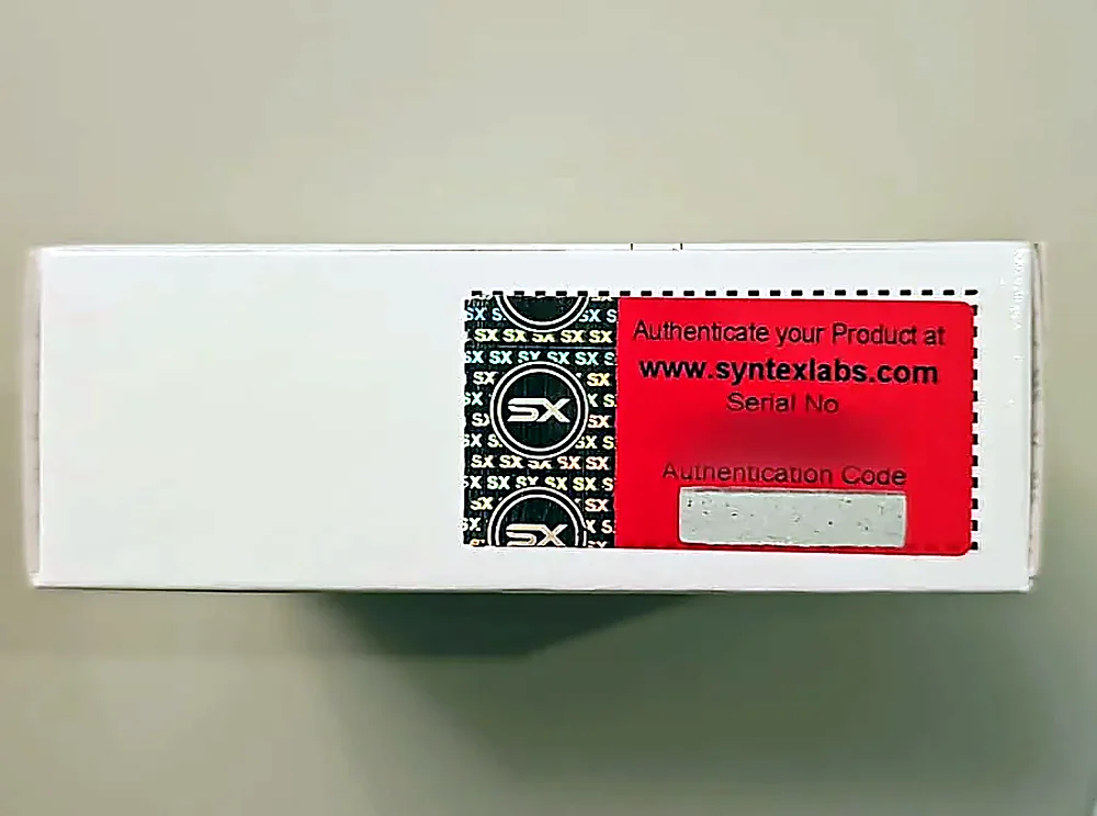 Red Syntex authenticity label with SX hologram on a product box; serial number blurred